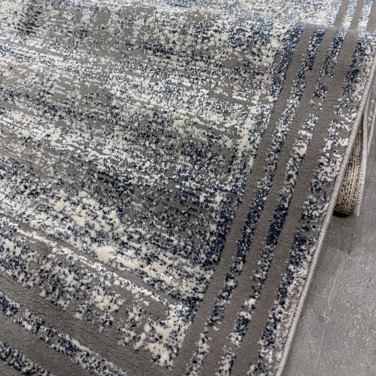 Laura mavi gri halı doku detayı